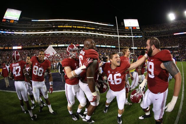 BATON ROUGE, LA - NOVEMBER 08:  Members of the Alabama Crimson Tide celebrate after winning in overtime against the LSU Tigers at Tiger Stadium on November 8, 2014 in Baton Rouge, Louisiana.  (Photo by Chris Graythen/Getty Images)