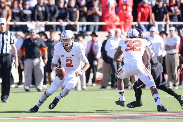 LUBBOCK, TX - OCTOBER 31: Mason Rudolph #2 of the Oklahoma State Cowboys scrambles for yardage during the game against the Texas Tech Red Raiders on October 31, 2015 at Jones AT&T Stadium in Lubbock, Texas. Oklahoma State defeated Texas Tech 70-53. (Photo by John Weast/Getty Images)