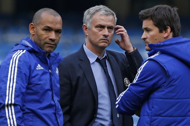 Chelsea's Portuguese manager Jose Mourinho (2nd L) stands with his coaching staff (L-R) Jose Morais, Rui Faria and Steve Holland, on the pitch after during the English Premier League football match between Chelsea and Liverpool at Stamford Bridge in London on October 31, 2015. Liverpool won the game 3-1. AFP PHOTO / IAN KINGTON

RESTRICTED TO EDITORIAL USE. No use with unauthorized audio, video, data, fixture lists, club/league logos or 'live' services. Online in-match use limited to 75 images, no video emulation. No use in betting, games or single club/league/player publications.        (Photo credit should read IAN KINGTON/AFP/Getty Images)
