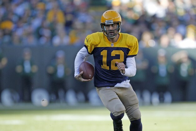 Green Bay Packers quarterback Aaron Rodgers rushes against the San Diego Chargers during an NFL football game Sunday Oct. 18, 2015, in Green Bay, Wis. (AP Photo/Matt Ludtke)