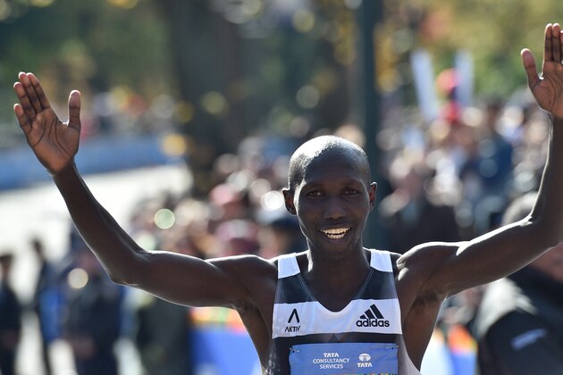 Nov 2, 2014; New York, NY, USA; Wilson Kipsang (2) celebrates after winning the Professional Men's division the 2014 TCS New York City Marathon. Mandatory Credit: Derik Hamilton-USA TODAY Sports Nov 2, 2014; New York, NY, USA; Wilson Kipsang (2) celebrates after winning the Professional Men's division the 2014 TCS New York City Marathon. Mandatory Credit: Derik Hamilton-USA TODAY Sports