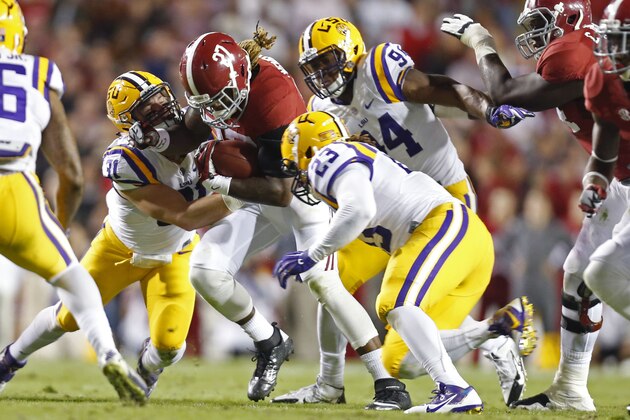 Alabama running back Derrick Henry (27) is tackled by LSU linebacker D.J. Welter (31)and linebacker Lamar Louis (23) in the first half of an NCAA college football game in Baton Rouge, La., Saturday, Nov. 8, 2014. (AP Photo/Jonathan Bachman) Alabama running back Derrick Henry (27) is tackled by LSU linebacker D.J. Welter (31)and linebacker Lamar Louis (23) in the first half of an NCAA college football game in Baton Rouge, La., Saturday, Nov. 8, 2014. (AP Photo/Jonathan Bachman)