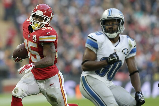 Kansas City Chiefs running back Charcandrick West (35), left, runs with the ball during the NFL football game between Detroit Lions and Kansas City Chiefs Wembley Stadium in London,  Sunday, Nov. 1, 2015. (AP Photo/Tim Ireland)