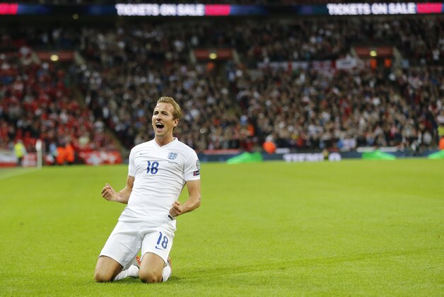 England’s Harry Kane celebrates after scoring the opening goal during the Euro 2016 Group E qualifying soccer match between England and Switzerland at Wembley stadium in London, England, Tuesday, Sept. 8, 2015 . (AP Photo/Frank Augstein)