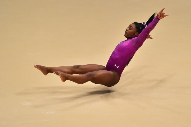 US Simone Biles performs during the Women's Floor Final at the 2015 World Gymnastics Championship in Glasgow, Scotland, on November 1, 2015.    AFP PHOTO / BEN STANSALL        (Photo credit should read BEN STANSALL,BEN STANSALL/AFP/Getty Images)