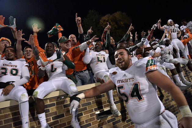 DURHAM, NC - OCTOBER 31: Miami Hurricanes players and fans celebrate after a win against the Duke Blue Devils at Wallace Wade Stadium on October 31, 2015 in Durham, North Carolina. Miami won 30-27 on a last-second touchdown. (Photo by Grant Halverson/Getty Images)