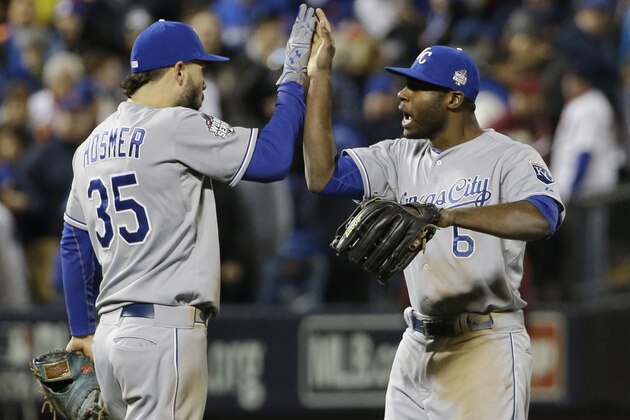 Kansas City Royals' Lorenzo Cain and Eric Hosmer celebrate after Game 4 of the Major League Baseball World Series against the New York Mets Saturday, Oct. 31, 2015, in New York. The Royals won 5-3 to take a 3-1 lead in the series. (AP Photo/David J. Phillip)