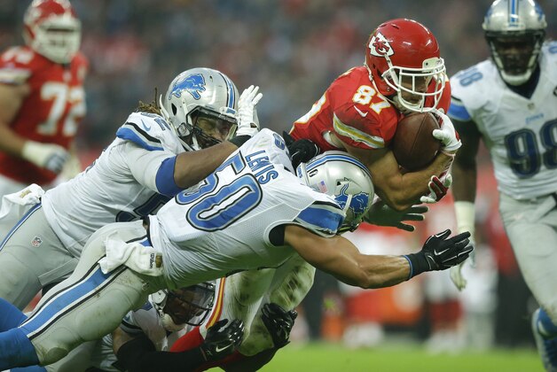 Kansas City Chiefs tight end Travis Kelce (87), right, is tackled during the NFL football game between Detroit Lions and Kansas City Chiefs Wembley Stadium in London,  Sunday, Nov. 1, 2015. (AP Photo/Matt Dunham)