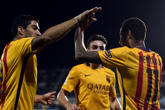 Barcelona's Brazilian forward Neymar (R) celebrates with Barcelona's Uruguayan forward Luis Suarez (L) after scoring a goal during the Spanish league football match Getafe CF vs FC Barcelona at the Coliseum Alfonso Perez stadium in Getafe on October 31, 2015.   AFP PHOTO / JAVIER SORIANO        (Photo credit should read JAVIER SORIANO/AFP/Getty Images)