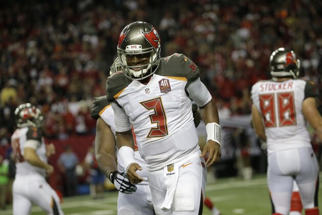 Tampa Bay Buccaneers quarterback Jameis Winston (3) walks off the field against the Atlanta Falcons during overtime of an NFL football game, Sunday, Nov. 1, 2015, in Atlanta. (AP Photo/David Goldman)
