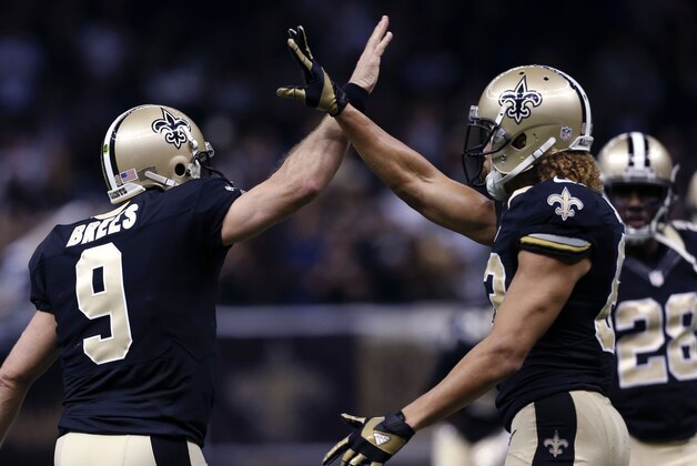 New Orleans Saints quarterback Drew Brees (9) celebrates with wide receiver Willie Snead (83) after Snead's touchdown reception in the first half of an NFL football game against the New York Giants in New Orleans, Sunday, Nov. 1, 2015. (AP Photo/Jonathan Bachman)
