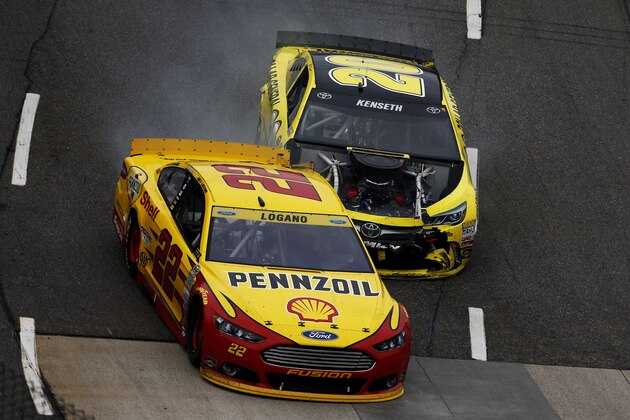 MARTINSVILLE, VA - NOVEMBER 01:  Matt Kenseth, driver of the #20 Dollar General Toyota, makes contact with Joey Logano, driver of the #22 Shell Pennzoil Ford, during the NASCAR Sprint Cup Series Goody's Headache Relief Shot 500 at Martinsville Speedway on November 1, 2015 in Martinsville, Virginia.  (Photo by Jeff Zelevansky/Getty Images)