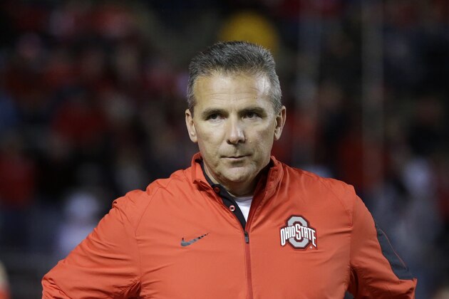 Ohio State head coach Urban Meyer stands on the field before an NCAA college football game against Rutgers Saturday, Oct. 24, 2015, in Piscataway, N.J. (AP Photo/Mel Evans)