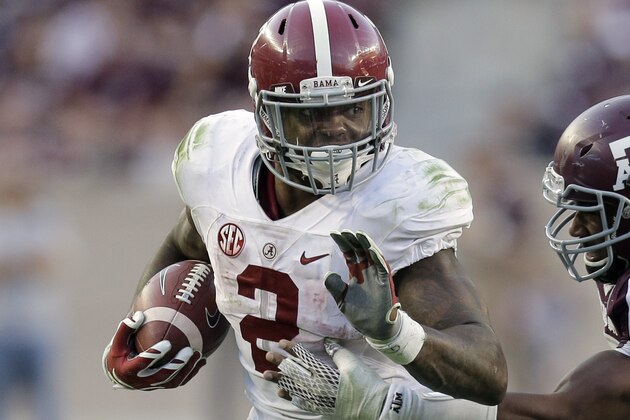 Alabama running back Derrick Henry (2) is chased by Texas A&M 's Myles Garrett, right, during the second half of an NCAA college football game, Saturday, Oct. 17, 2015, in College Station, Texas. Alabama won 41-23. (AP Photo/Eric Gay)
