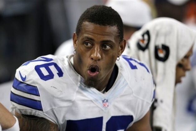 FILE - In this Aug. 29, 2015, file photo, Dallas Cowboys defensive end Greg Hardy (76) talks with teammates on the sideline during a preseason NFL football game against the Minnesota Vikings in Arlington, Texas. Several teams will be missing key players when the NFL season kicks off this weekend.  (AP Photo/Brandon Wade, File)
