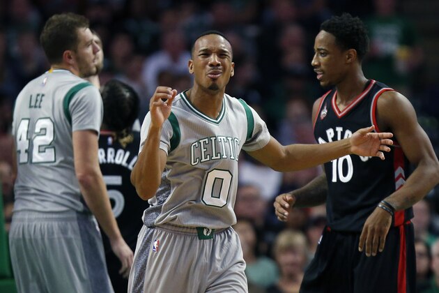 Boston Celtics' Avery Bradley (0) reacts beside Toronto Raptors' DeMar DeRozan (10) after being called for a foul during the second quarter of an NBA basketball game in Boston, Friday, Oct. 30, 2015. (AP Photo/Michael Dwyer)