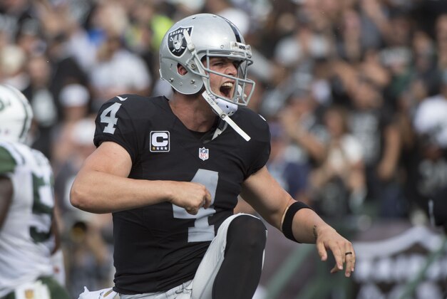 November 1, 2015; Oakland, CA, USA; Oakland Raiders quarterback Derek Carr (4) celebrates after throwing a touchdown pass against the New York Jets during the second quarter at O.co Coliseum. Mandatory Credit: Kyle Terada-USA TODAY Sports