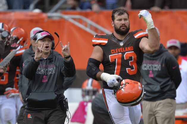 Cleveland Browns special teams coordinator Chris Tabor, left, calls for a two-point conversion attempt beside tackle Joe Thomas (73) in the fourth quarter against the Denver Broncos Sunday, Oct. 18, 2015, in Cleveland. Denver won 26-23 in overtime. (AP Photo/David Richard)