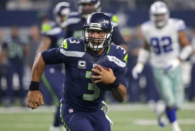 Seattle Seahawks' Russell Wilson (3) runs the ball late in the second half of an NFL football game against the Dallas Cowboys, Sunday, Nov. 1, 2015, in Arlington, Texas. (AP Photo/Brandon Wade)