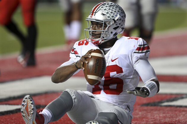 Ohio State quarterback J.T. Barrett (16) scores a touchdown during an NCAA college football game against Rutgers Saturday, Oct. 24, 2015, in Piscataway, N.J. (AP Photo/Mel Evans)