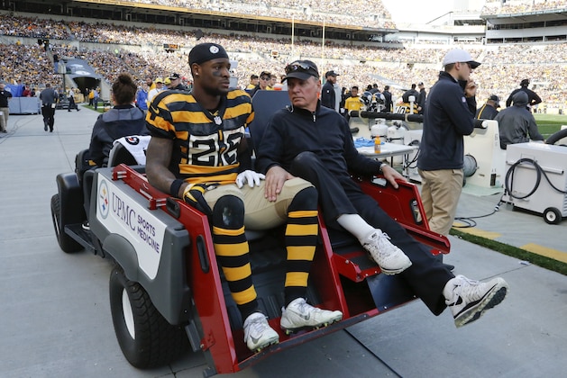 Pittsburgh Steelers running back Le'Veon Bell (26) is carted off the field after being injured in the second quarter of an NFL football game against the Cincinnati Bengals, Sunday, Nov. 1, 2015, in Pittsburgh. (AP Photo/Gene Puskar)
