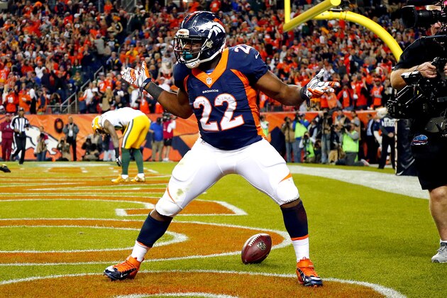 Denver Broncos running back C.J. Anderson (22) celebrates his touchdown in the end zone during the second half of an NFL football game against the Green Bay Packers, Sunday, Nov. 1, 2015, in Denver. (AP Photo/Jack Dempsey)