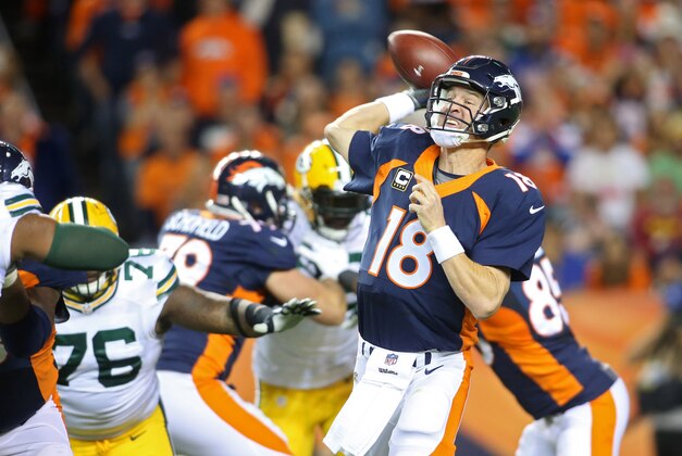 Nov 1, 2015; Denver, CO, USA; Denver Broncos quarterback Peyton Manning (18) throws a pass during the first half against the Green Bay Packers at Sports Authority Field at Mile High. The Broncos won 29-10. Mandatory Credit: Chris Humphreys-USA TODAY Sports