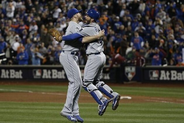 Kansas City Royals pitcher Wade Davis (17) celebrates with Drew Butera\after Game 5 of the Major League Baseball World Series against the New York Mets Monday, Nov. 2, 2015, in New York. The Royals won 7-2 to win the series. (AP Photo/Matt Slocum)