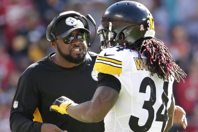 Pittsburgh Steelers head coach Mike Tomlin, left, addresses running back DeAngelo Williams (34) during the first half of an NFL football game against the Kansas City Chiefs in Kansas City, Mo., Sunday, Oct. 25, 2015. (AP Photo/Charlie Riedel)