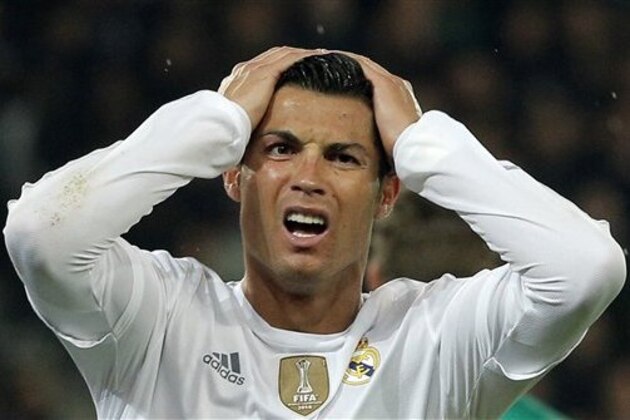 Real Madrid's Cristiano Ronaldo reacts after missing a goal during the Champions League group A soccer match between Paris St Germain and Real Madrid at the Parc des Princes stadium in Paris, Wednesday, Oct. 21, 2015. (AP Photo/Thibault Camus)