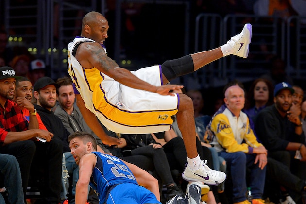 Nov 1, 2015; Los Angeles, CA, USA; Los Angeles Lakers forward Kobe Bryant (24) is fouled by Dallas Mavericks forward Chandler Parsons (25) as he goes for a 3 point basket in the first quarter of the game at Staples Center. Mandatory Credit: Jayne Kamin-Oncea-USA TODAY Sports