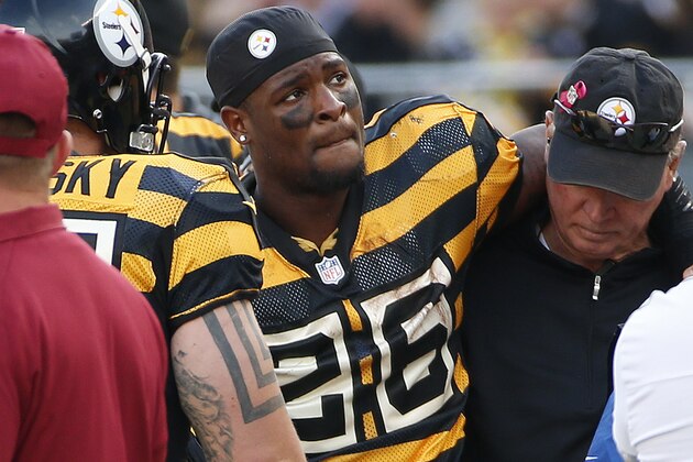 Pittsburgh Steelers running back Pittsburgh Steelers running back Le'Veon Bell (26) is helped by a team doctor after injuring his right knee in the first half of an NFL football game against the Cincinnati Bengals, Sunday, Nov. 1, 2015 in Pittsburgh. Bell was driven off the field, and did not return to the game. (AP Photo/Gene Puskar)