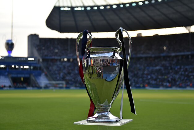 The Champions League trophy is displayed prior to the Champions League final soccer match between Juventus Turin and FC Barcelona at the Olympic stadium in Berlin Saturday, June 6, 2015. (AP Photo/Martin Meissner)