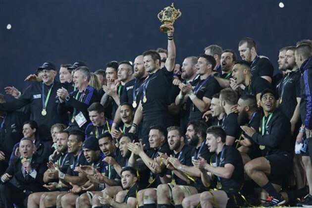 New Zealand's captain Richie McCaw holds the trophy aloft after the Rugby World Cup final between New Zealand and Australia at Twickenham Stadium in London,  Saturday, Oct. 31, 2015.  The All Blacks won 34-17. (AP Photo/Tim Ireland)