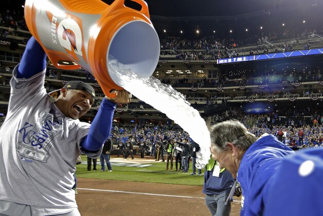 Kansas City Royals' Salvador Perez dunks manager Ned Yost after Game 5 of the Major League Baseball World Series against the New York Mets Monday, Nov. 2, 2015, in New York. The Royals won 7-2 to win the series. (AP Photo/David J. Phillip)