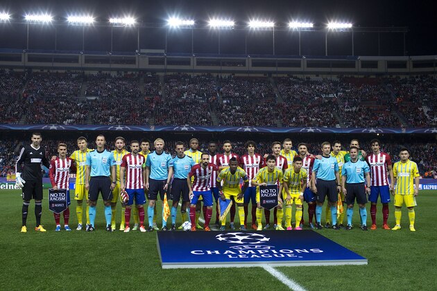 MADRID, SPAIN - OCTOBER 21: Atletico de Madrid and FC Astana pose for a temam photo holding the UEFA No To Racism pennant prior to start the UEFA Champions League Group C match between Club Atletico de Madrid and FC Astana at Vicente Calderon stadium on October 21, 2015 in Madrid, Spain.  (Photo by Gonzalo Arroyo Moreno/Getty Images)