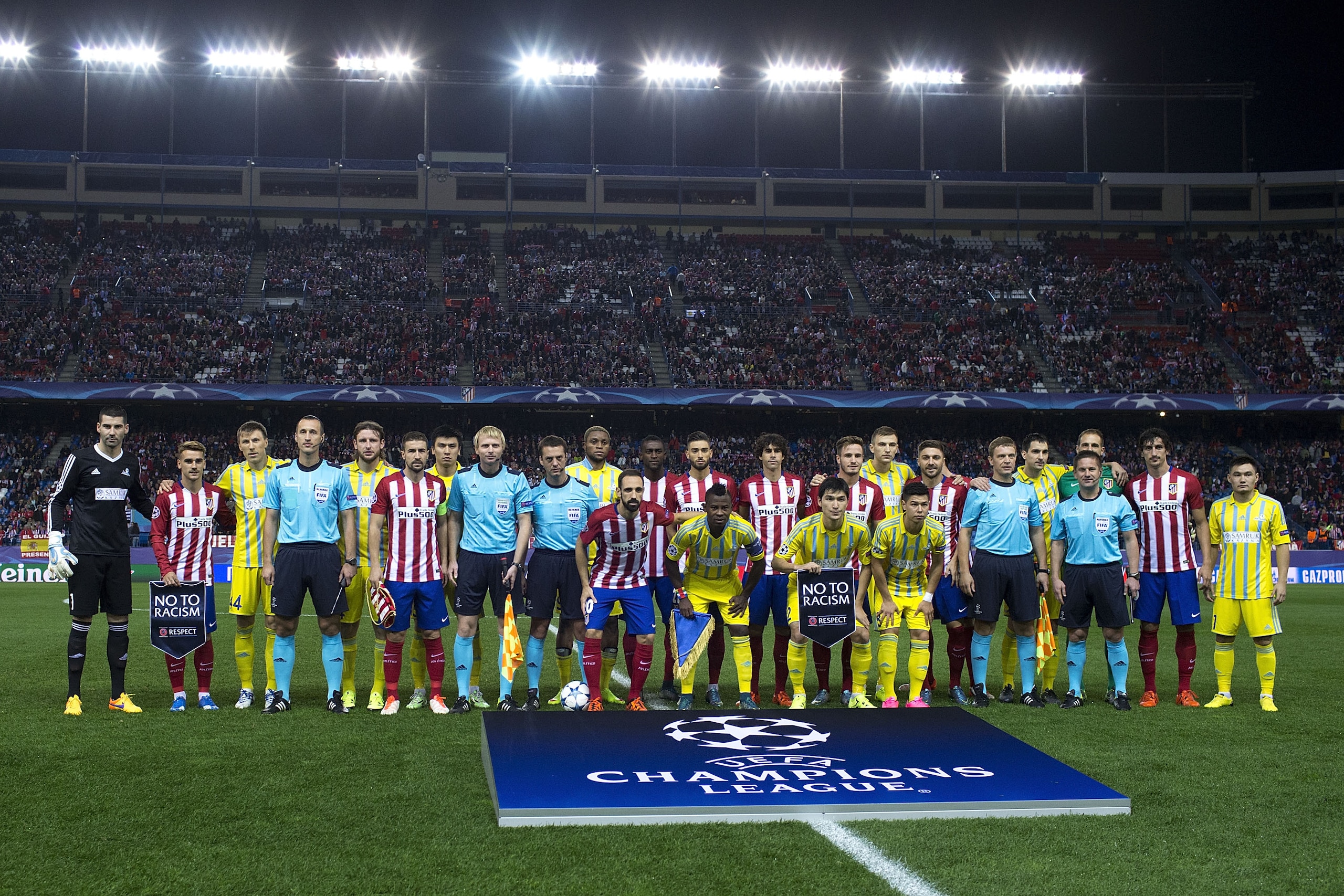 MADRID, SPAIN - OCTOBER 21: Atletico de Madrid and FC Astana pose for a temam photo holding the UEFA No To Racism pennant prior to start the UEFA Champions League Group C match between Club Atletico de Madrid and FC Astana at Vicente Calderon stadium on October 21, 2015 in Madrid, Spain.  (Photo by Gonzalo Arroyo Moreno/Getty Images)