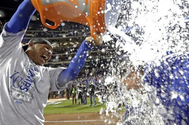 Kansas City Royals' Salvador Perez dunks manager Ned Yost after Game 5 of the Major League Baseball World Series against the New York Mets Monday, Nov. 2, 2015, in New York. The Royals won 7-2 to win the series. (AP Photo/David J. Phillip)