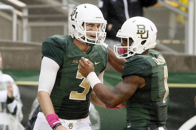 Baylor quarterback Jarrett Stidham (3) and wide receiver Corey Coleman, right, celebrate a touchdown scored by Coleman on a pass play from Stidham in the second half of an NCAA college football game against Iowa State Saturday, Oct. 24, 2015, in Waco, Texas. Stidham will replace starter Seth Russell, one of the nation's best quarterbacks, who is done for the season at unbeaten and No. 2 Baylor. (AP Photo/Tony Gutierrez)