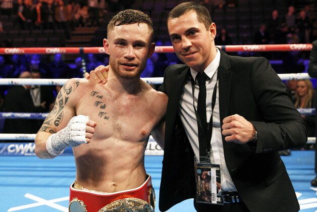 IBF world champion Carl Frampton, left, poses for a photo with WBA world super bantamweight champion Scott Quigg after defeating Chris Avalos of the U.S. during their IBF super bantamweight world boxing title fight at the Odyssey arena in Belfast, Northern Ireland, Saturday, Feb. 28, 2015. (AP Photo/Peter Morrison)