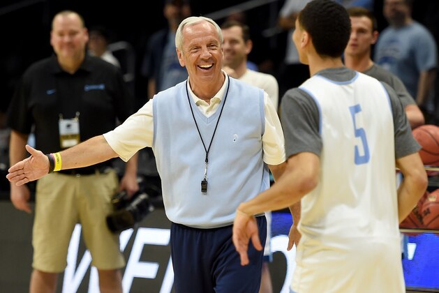 LOS ANGELES, CA - MARCH 25:  Head Coach Roy Williams of the North Carolina Tar Heels laughs with Marcus Paige #5 during practice at Staples Center on March 25, 2015 in Los Angeles, California.  (Photo by Harry How/Getty Images)