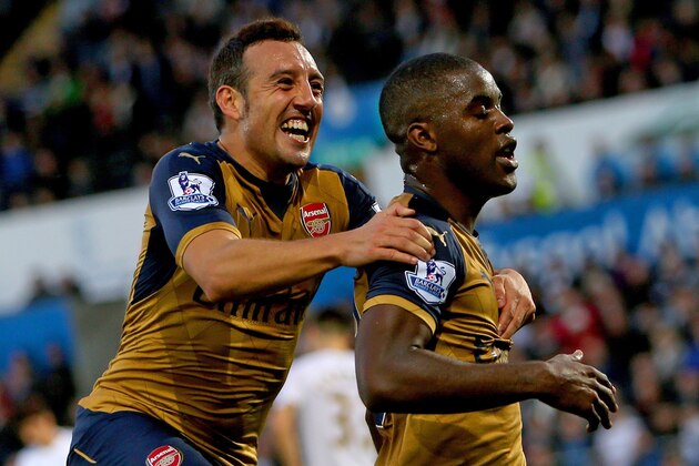 Arsenal's Costa Rican striker Joel Campbell (R) celebrates with Arsenals Spanish midfielder Santi Cazorla after scoring their third goal during the English Premier League football match between Swansea City and Arsenal at The Liberty Stadium in Swansea, south Wales on October 31, 2015. Arsenal won the game 3-0. AFP PHOTO / GEOFF CADDICK

RESTRICTED TO EDITORIAL USE. No use with unauthorized audio, video, data, fixture lists, club/league logos or 'live' services. Online in-match use limited to 75 images, no video emulation. No use in betting, games or single club/league/player publications.        (Photo credit should read GEOFF CADDICK/AFP/Getty Images)