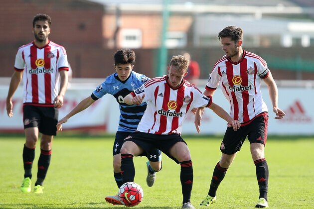 SUNDERLAND, ENGLAND - AUGUST 23:  Cy Goddard of Spurs battles with Rees Greenwood and Liam Agnew of Sunderland during the Barclays U21 Premier League match between Sunderland U21 and Tottenham Hotspur U21 at Eppleton Colliery Welfare ground on August 23, 2015 in Sunderland, England.  (Photo by Jan Kruger/Getty Images)