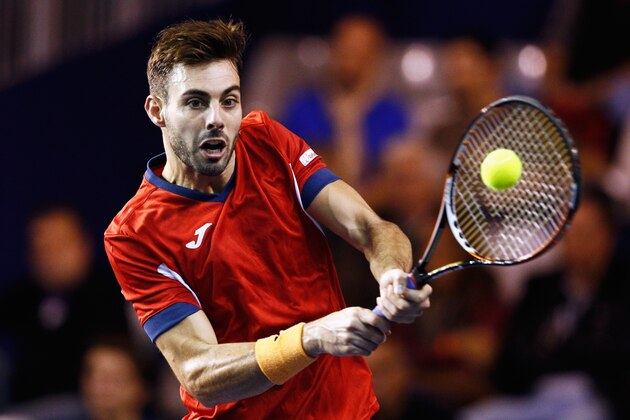 PARIS, FRANCE - NOVEMBER 02:  Marcel Granollers of Spain in action against Aljaz Bedene of Great Britain during Day 1 of the BNP Paribas Masters held at AccorHotels Arena on November 2, 2015 in Paris, France.  (Photo by Dean Mouhtaropoulos/Getty Images)