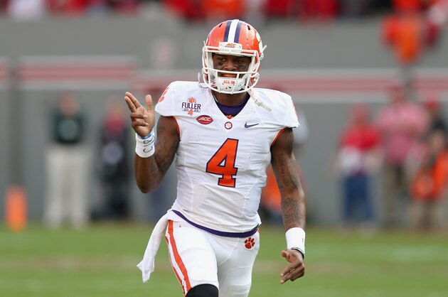 RALEIGH, NC - OCTOBER 31:  Deshaun Watson #4 of the Clemson Tigers celebrates after throwing a touchdown during their game against the North Carolina State Wolfpack at Carter-Finley Stadium on October 31, 2015 in Raleigh, North Carolina.  (Photo by Streeter Lecka/Getty Images)