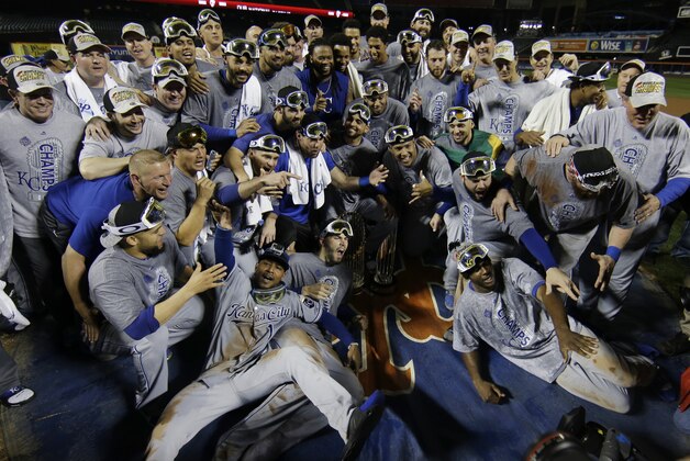 Kansas City Royals pose with World Series trophy after Game 5 of the Major League Baseball World Series against the New York Mets Monday, Nov. 2, 2015, in New York. The Royals won 7-2 to win the series. (AP Photo/Matt Slocum)