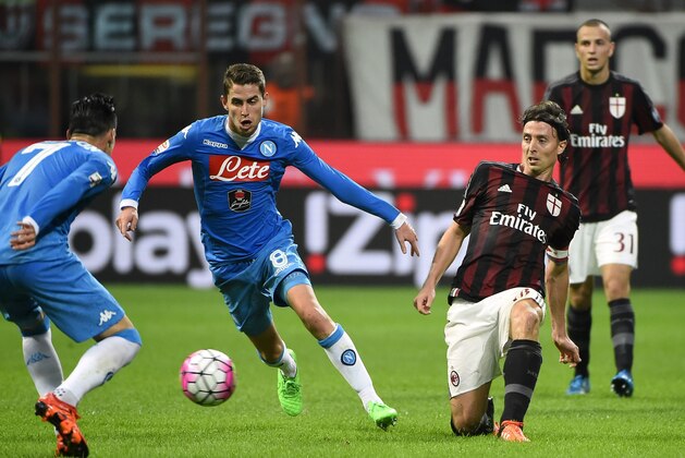 AC Milan's midfielder Riccardo Montolivo (R) vies for the ball with Napoli's Brazilian midfielder Jorginho (C) during the Italian Serie A football match between AC Milan and Napoli at San Siro Stadium in Milan on October 4, 2015. AFP PHOTO / OLIVIER MORIN (Photo credit should read OLIVIER MORIN/AFP/Getty Images) AC Milan's midfielder Riccardo Montolivo (R) vies for the ball with Napoli's Brazilian midfielder Jorginho (C) during the Italian Serie A football match between AC Milan and Napoli at San Siro Stadium in Milan on October 4, 2015. AFP PHOTO / OLIVIER MORIN (Photo credit should read OLIVIER MORIN/AFP/Getty Images)
