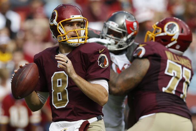 In this photo taken Oct. 25, 2015, Washington Redskins quarterback Kirk Cousins (8) passes the ball during the first half of an NFL football game against the Tampa Bay Buccaneers in Landover, Md. If Kirkthrows an interception in a game, he throws a second, and the Washington Redskins lose. If Cousins plays a pick-free game, the Redskins win. It really is that simple so far this season.  (AP Photo/Patrick Semansky)