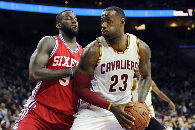 Cleveland Cavaliers' LeBron James (23) drives to the basket as Philadelphia 76ers' Jakarr Sampson defends during the first half of an NBA basketball game Monday, Nov. 2, 2015, in Philadelphia. (AP Photo/Michael Perez)