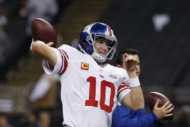New York Giants quarterback Eli Manning (10) warms up before an NFL football game against the New Orleans Saints in New Orleans, Sunday, Nov. 1, 2015. (AP Photo/Jonathan Bachman)